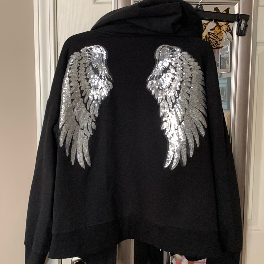 Custom made. Sweatshirt full zip. The sequin wings on the back are gorgeous.